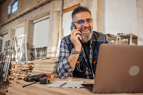 A Business owner on the phone with ZipLocal